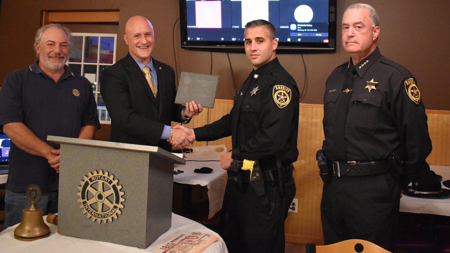 Sponsor of this Month’s Monticello Rotary’s T.A.C.T.I.C.A.L. Award plaque and dinners, Rotarian 
Carmine Ribaudo, left, president Todd Grodin, deputy Markus V. Pratti, and sheriff Mike Schiff.
